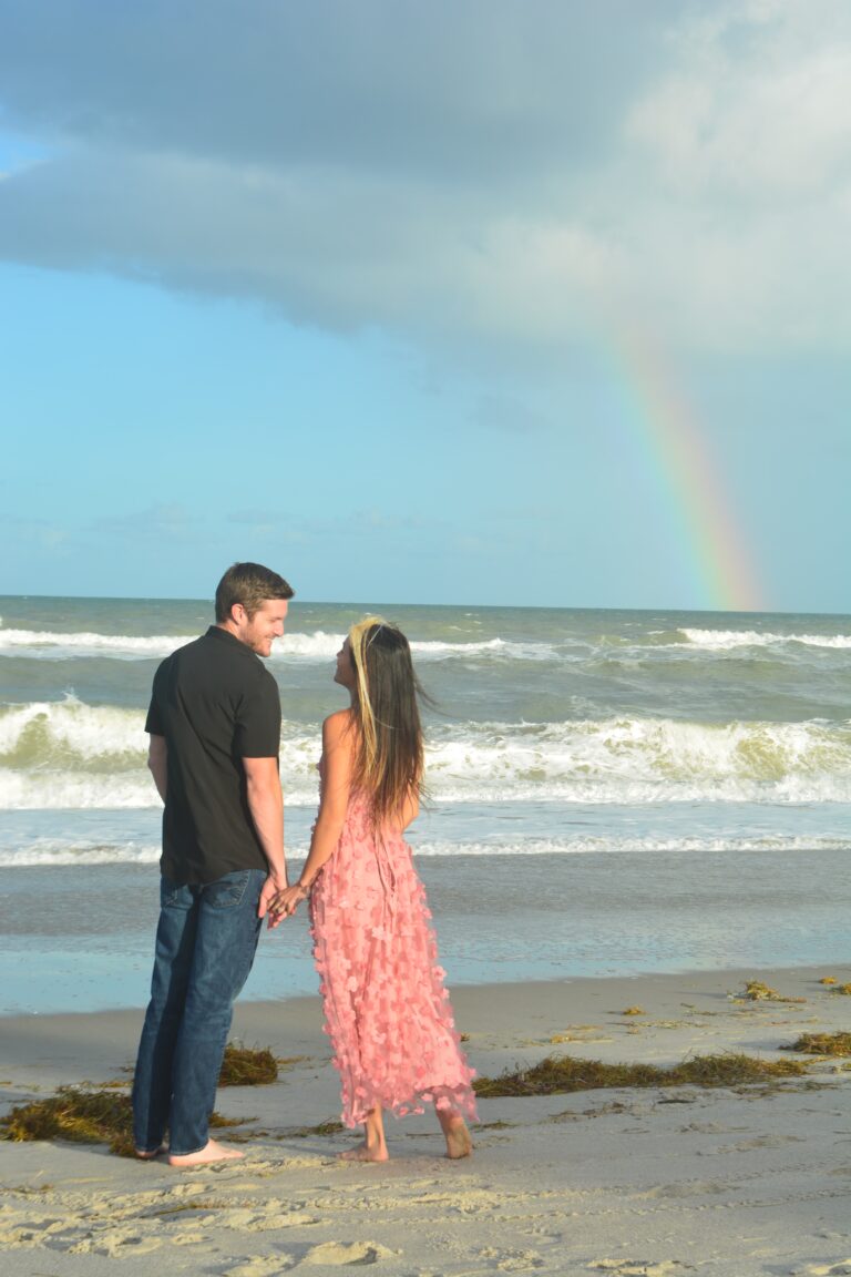 A couple on the beach at sunset — relationships and coastal living