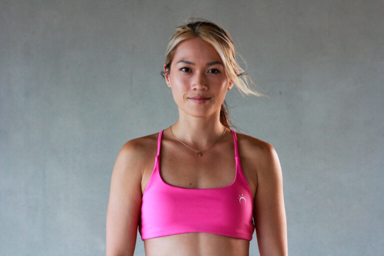 Woman in a pink sports bra — fitness and confidence in your 30s