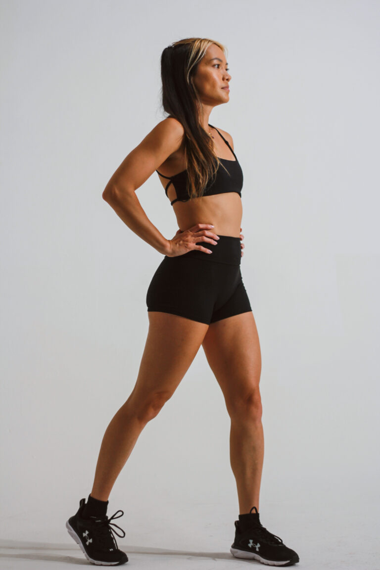 Woman in black activewear at the gym — strength training in your 30s