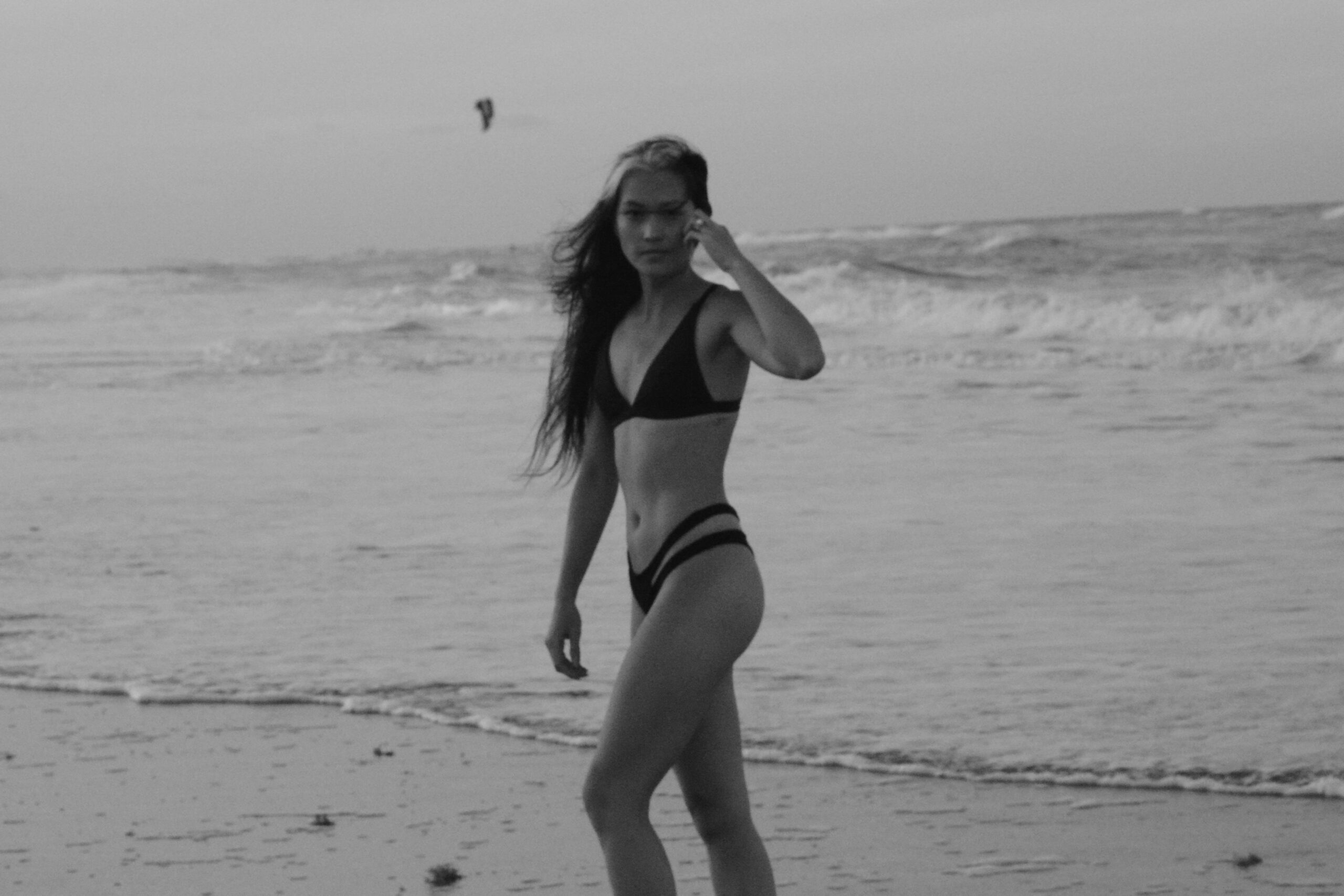 woman at the beach black and white