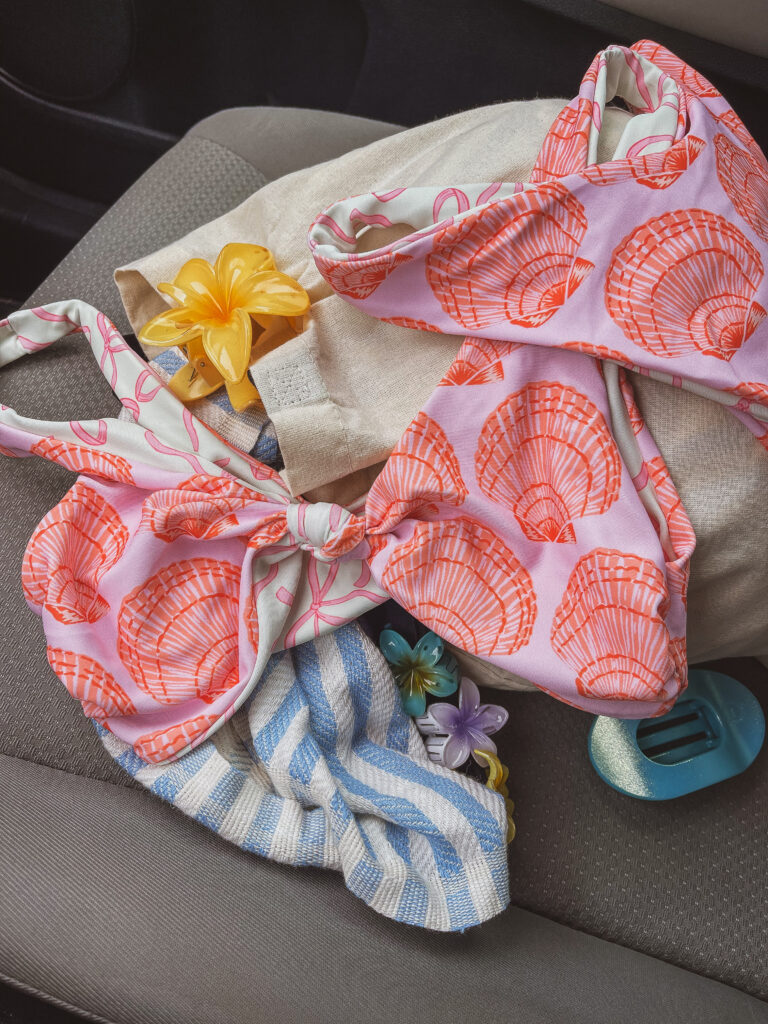 A soft flat lay of gift items and flowers