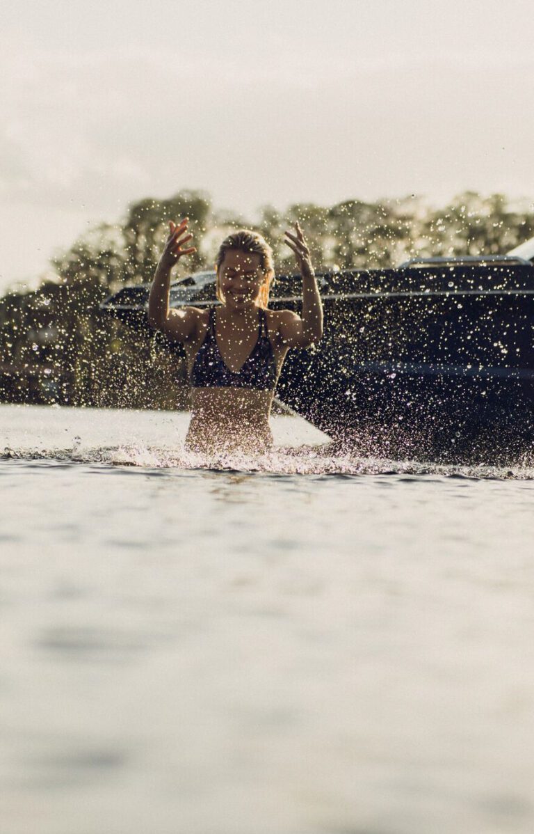 Woman playing in the ocean water