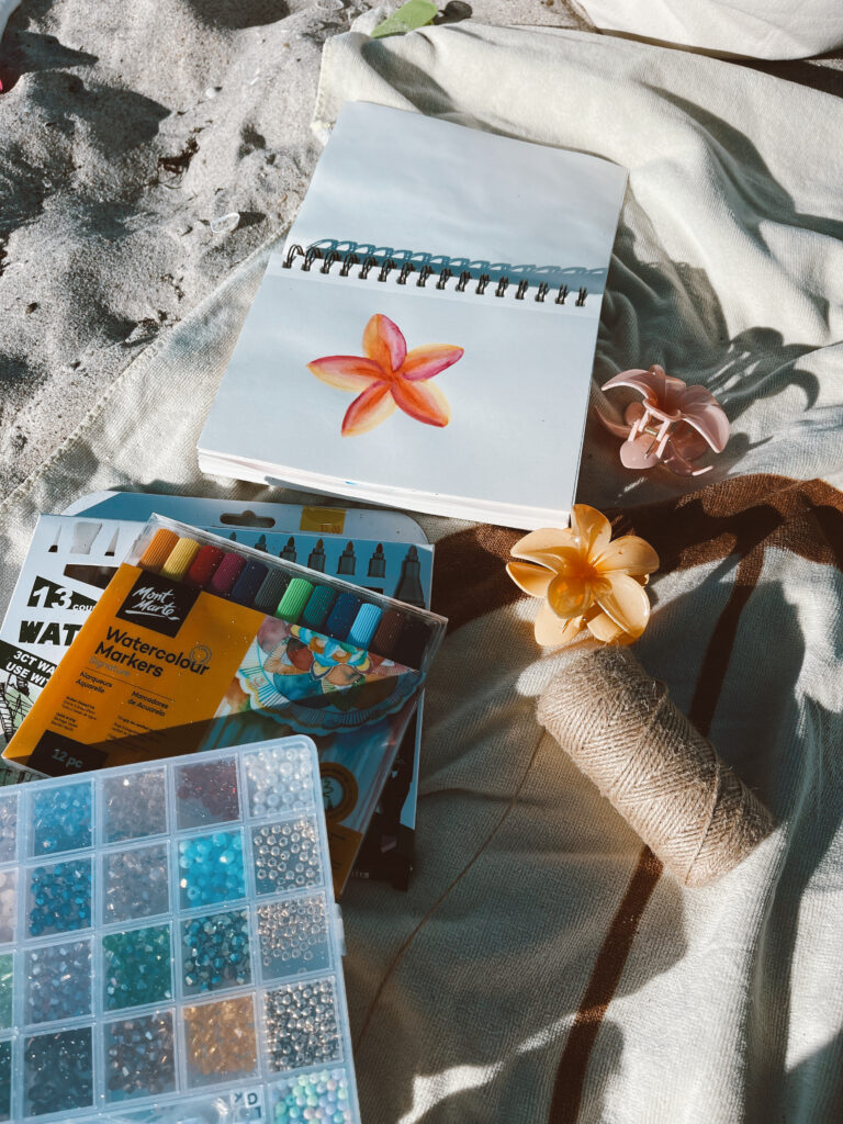 Starfish and a magazine on the sand