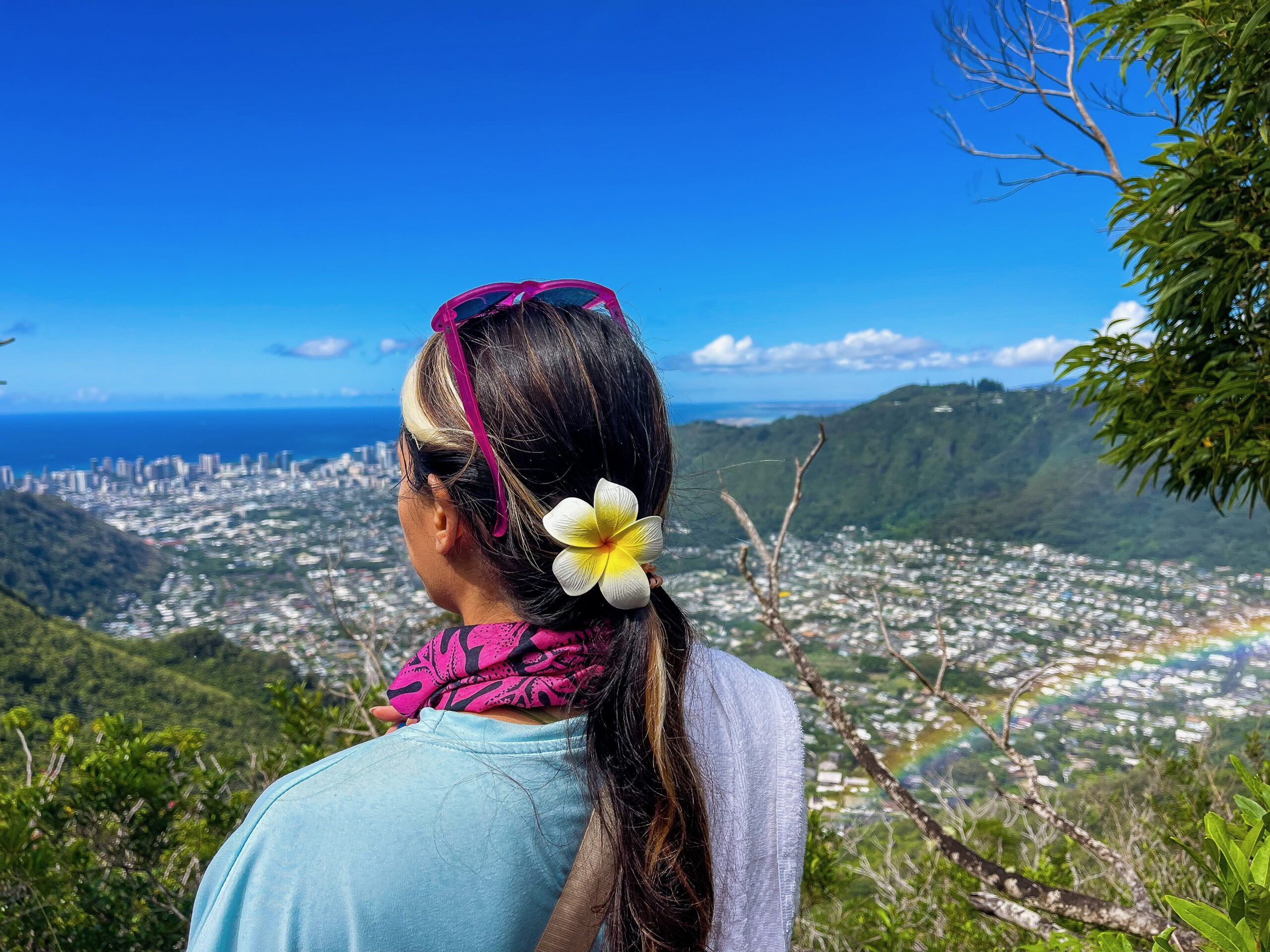 woman overlooking hawaii on a trail