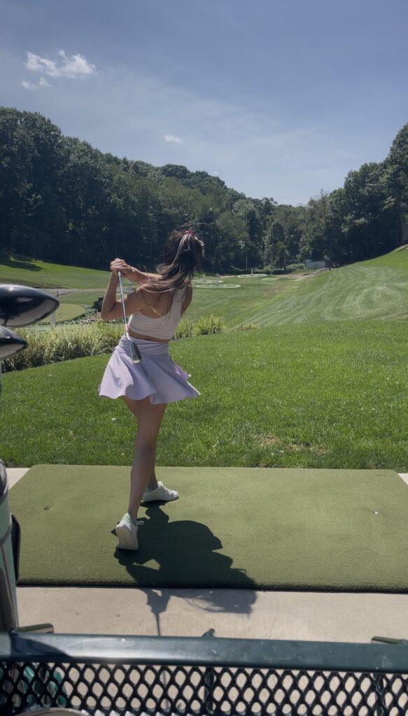 Practising my swing on the range mat