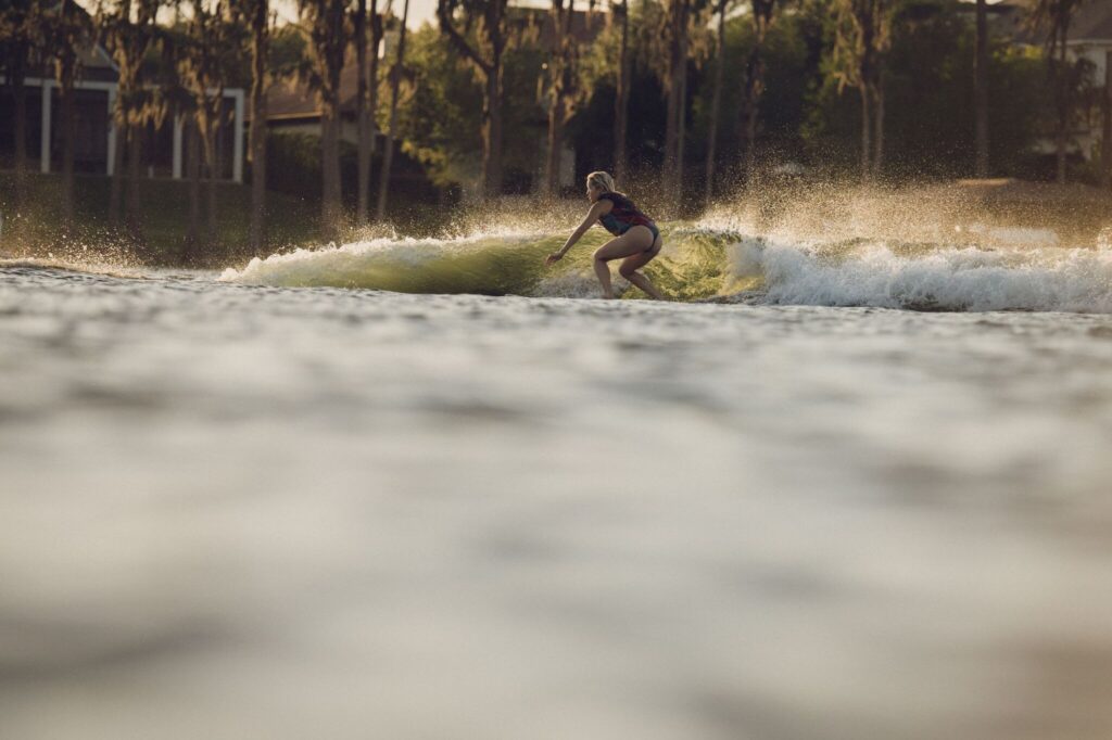 Surfing a wave at golden hour